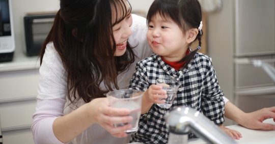 family drinking tap water