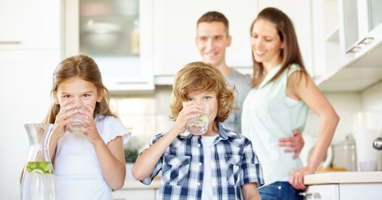 family drinking water