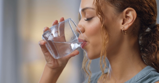 Woman drinking glass of water