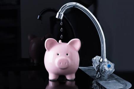 water into piggy bank